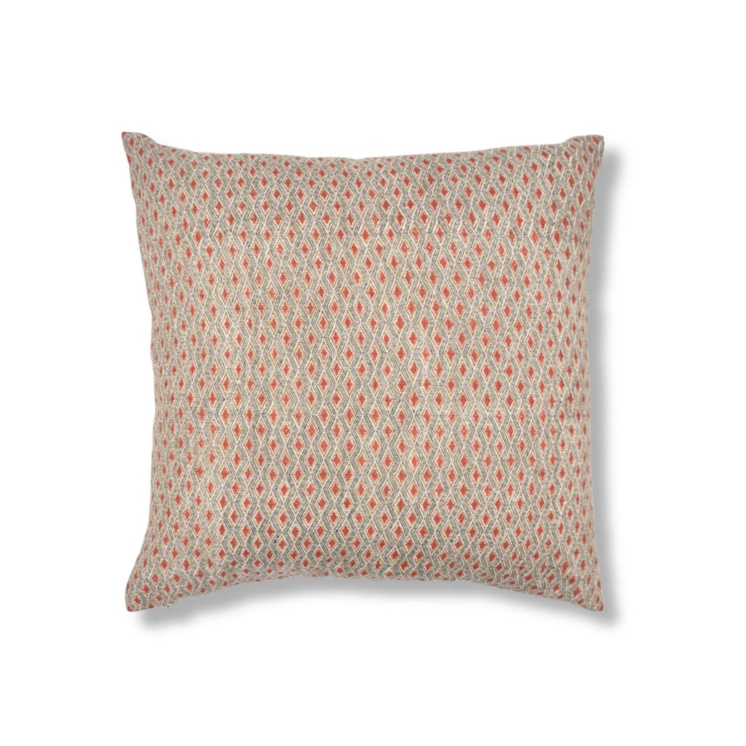 A square throw pillow featuring a dense, small-scale geometric diamond pattern in muted terracotta red and blue on a plain white studio background.