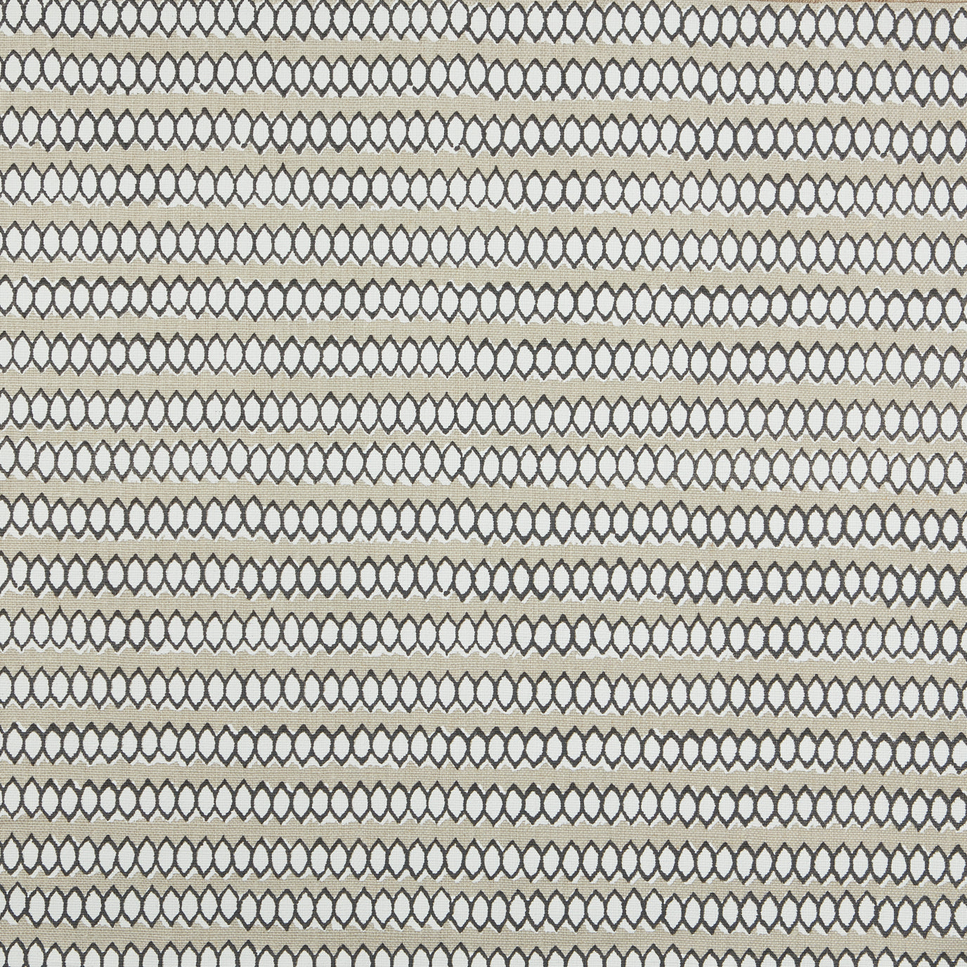 Swatch of fabric with rows of hand-drawn black and white honeycomb shapes on a tan background.