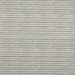 Swatch of fabric with rows of hand-drawn black and white honeycomb shapes on a tan background.