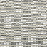 Swatch of fabric with rows of hand-drawn black and white honeycomb shapes on a tan background.