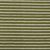 Swatch of fabric with rows of hand-drawn green and olive honeycomb shapes on a cream background.