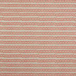Swatch of fabric with rows of hand-drawn red and peach honeycomb shapes on a tan background.