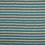 Swatch of fabric with rows of hand-drawn navy and turquoise honeycomb shapes on a cream background.
