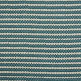 Swatch of fabric with rows of hand-drawn navy and turquoise honeycomb shapes on a cream background.