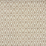 Detail of a handowven rug in an diamond like pattern in white and soft pink.