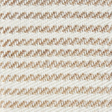 Detail of a textural rug in natural fiber and white yarn.