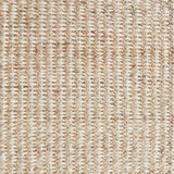 Detail of a textural rug in natural fiber and cream yarn.