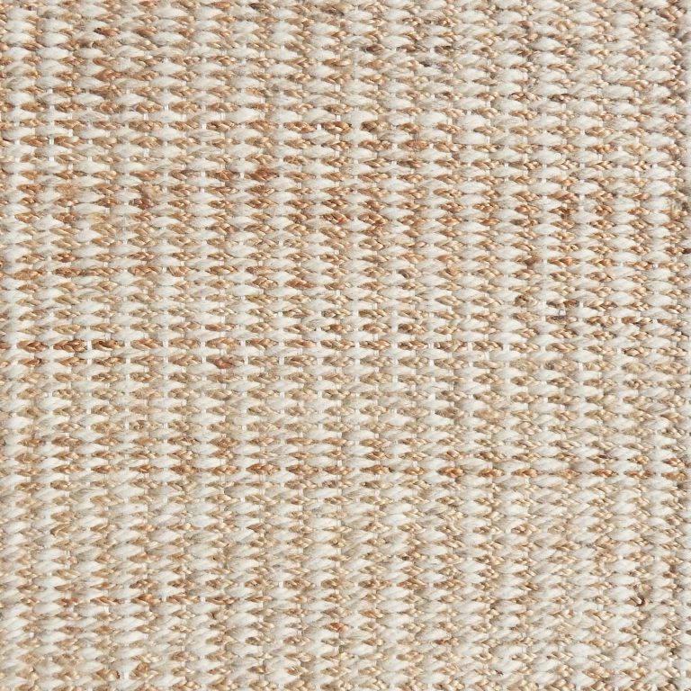 Detail of a textural rug in natural fiber and cream yarn.