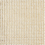 Detail of a textural rug in natural fiber and grey yarn.
