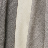 A row of three draped sheer interior fabric swatches in mottled gray and cream.