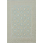 Patterned rug with geometric design on a light gray background