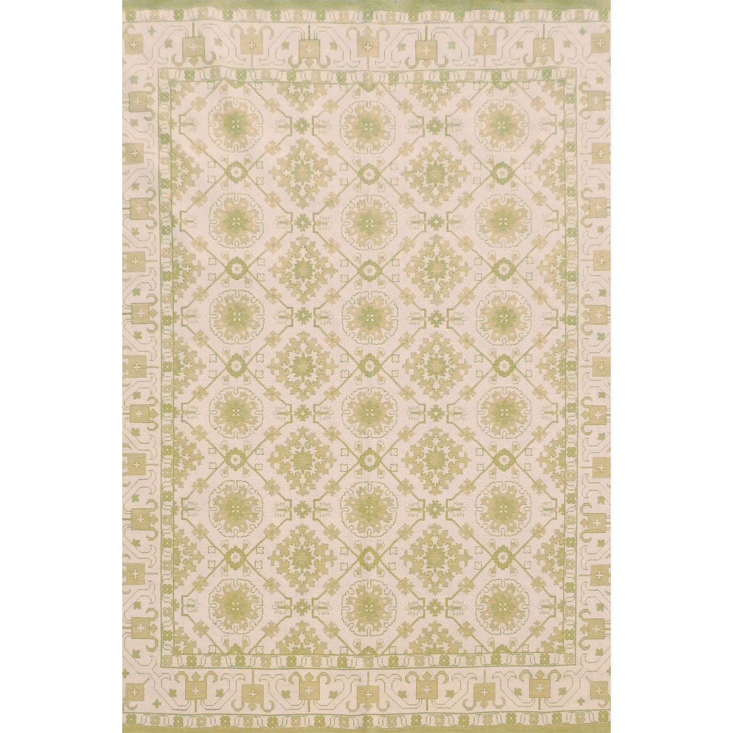 Handmade rug with with ornate green and cream design.