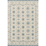 Decorative rug with geometric pattern in grey and blue on a white background