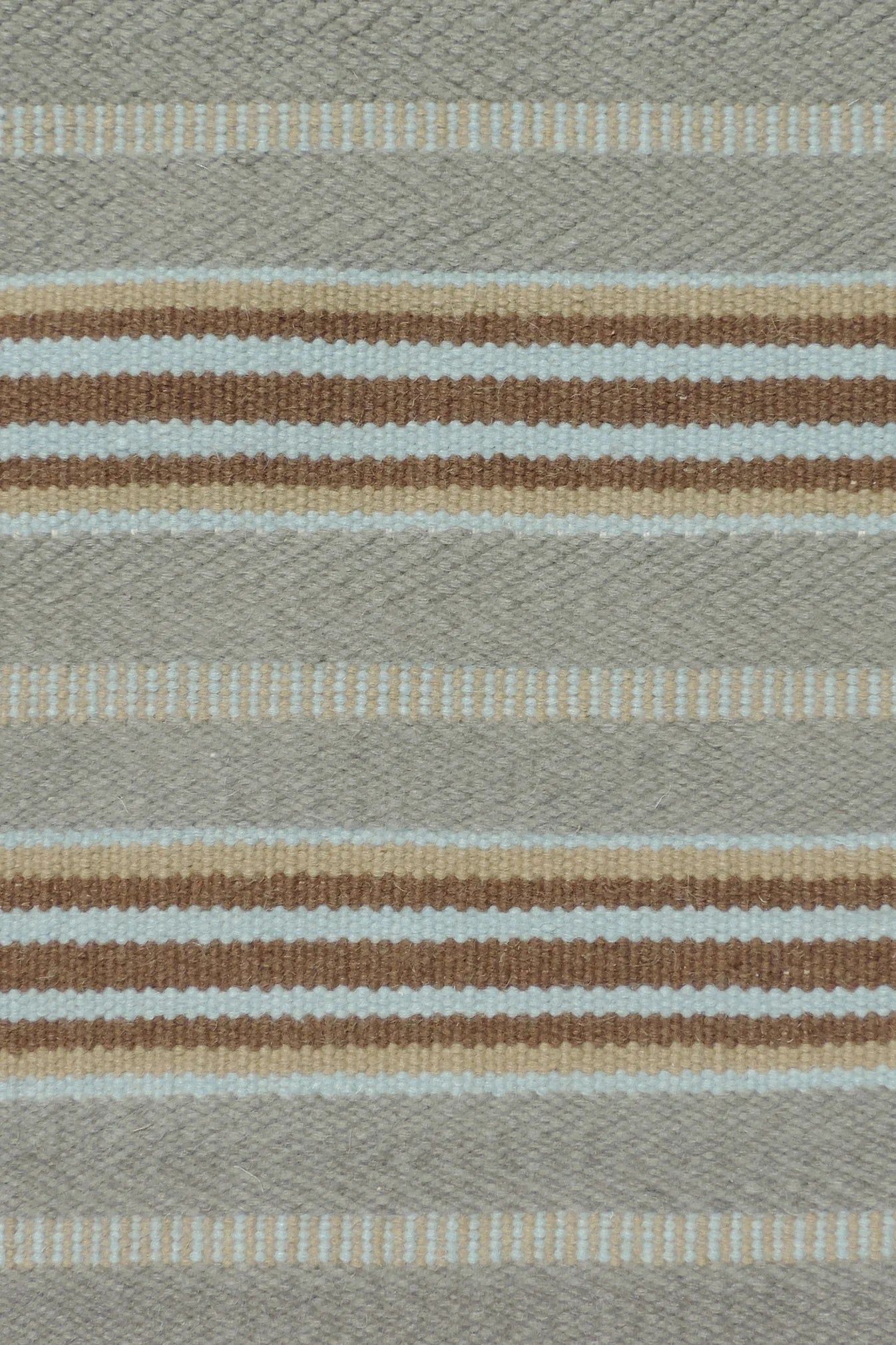 Handmade rug with stripes in grey, blue and brown.