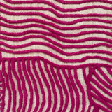 Close-up of carpet with wavy magenta lines on a beige background
