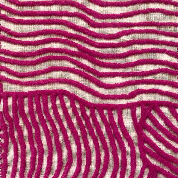 Close-up of carpet with wavy magenta lines on a beige background