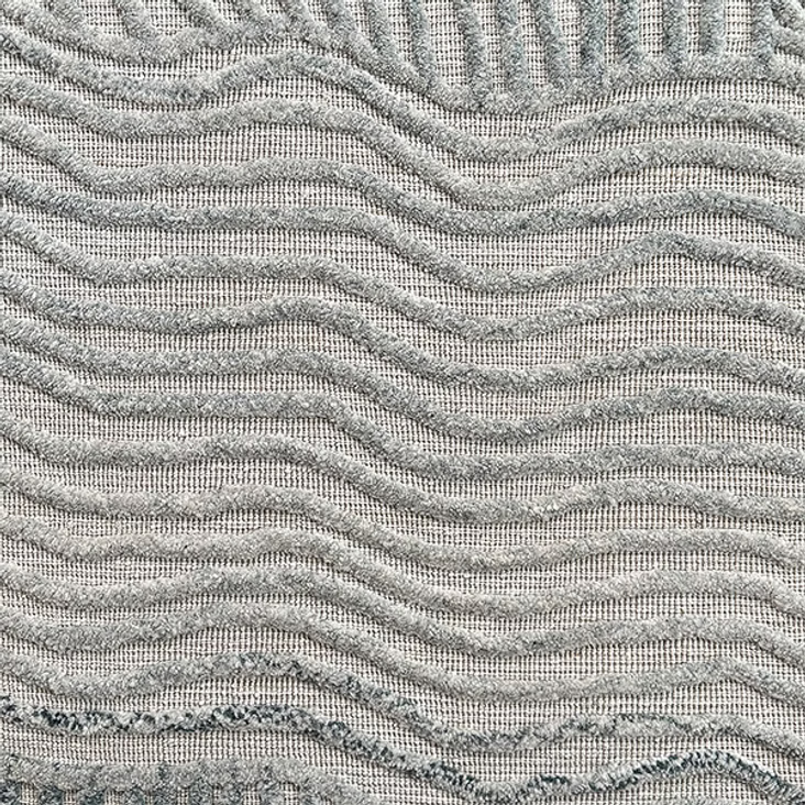 Textured carpet with wavy pattern in gray tones