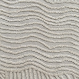 Textured carpet with wavy pattern in gray tones