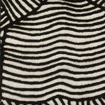 Close-up of textured carpet black wavy lines on a white background