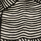 Close-up of textured carpet black wavy lines on a white background