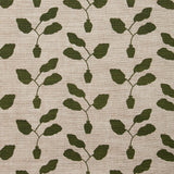 Fabric swatch with a three leafed plant in a pot motif in bottle green on a textured woven linen in oatmeal.