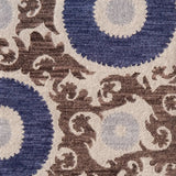Decorative rug with floral scroll pattern pattern in blue and brown on a beige background