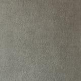 Detail of wallpaper in a muted textural print in mottled gray.