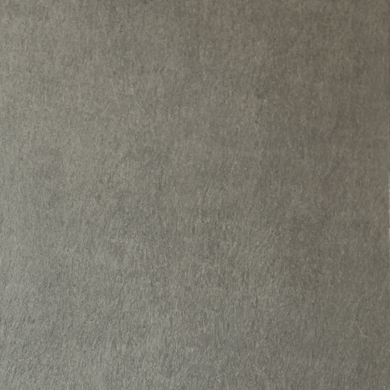 Detail of wallpaper in a muted textural print in mottled gray.