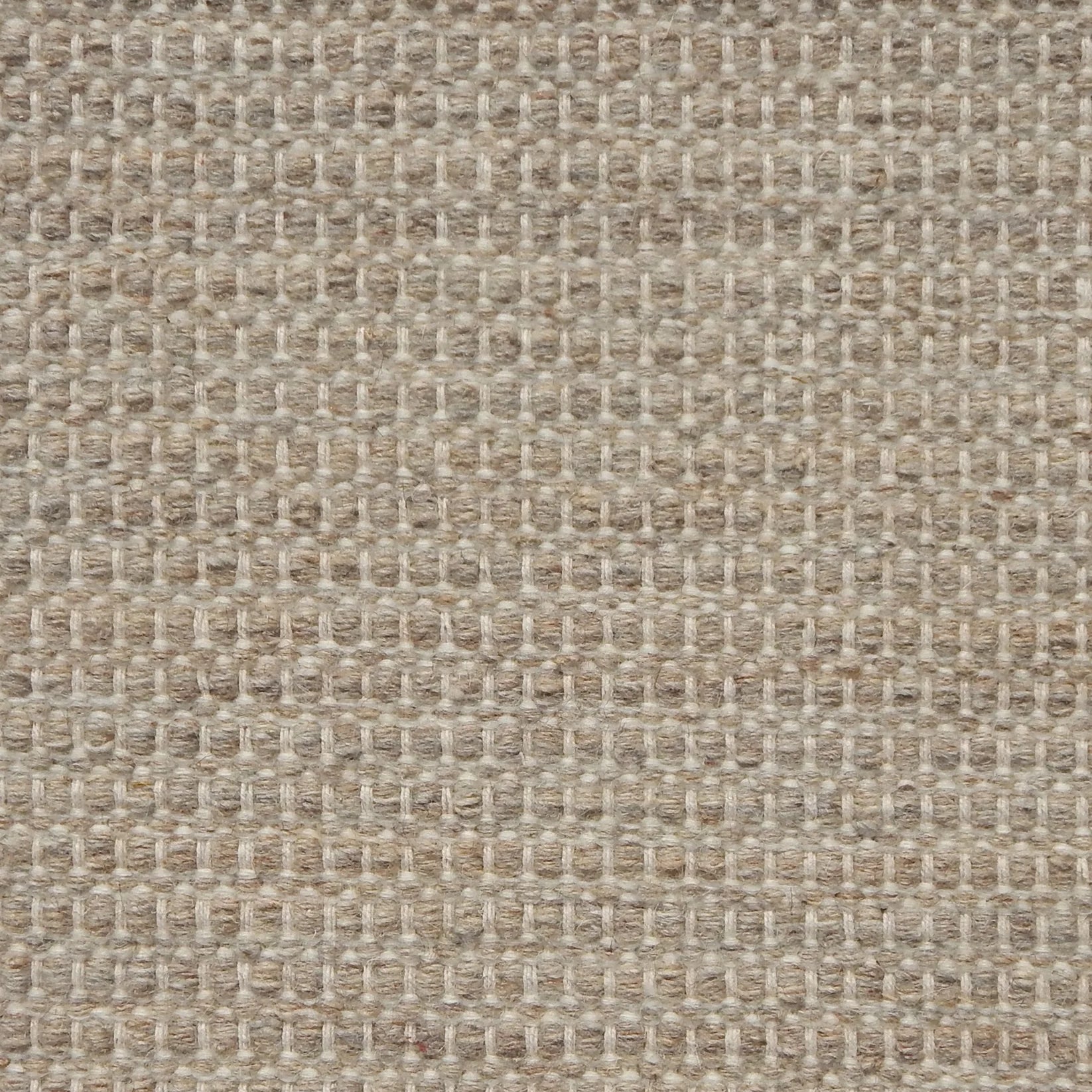 Textured handwoven carpet in oatmeal