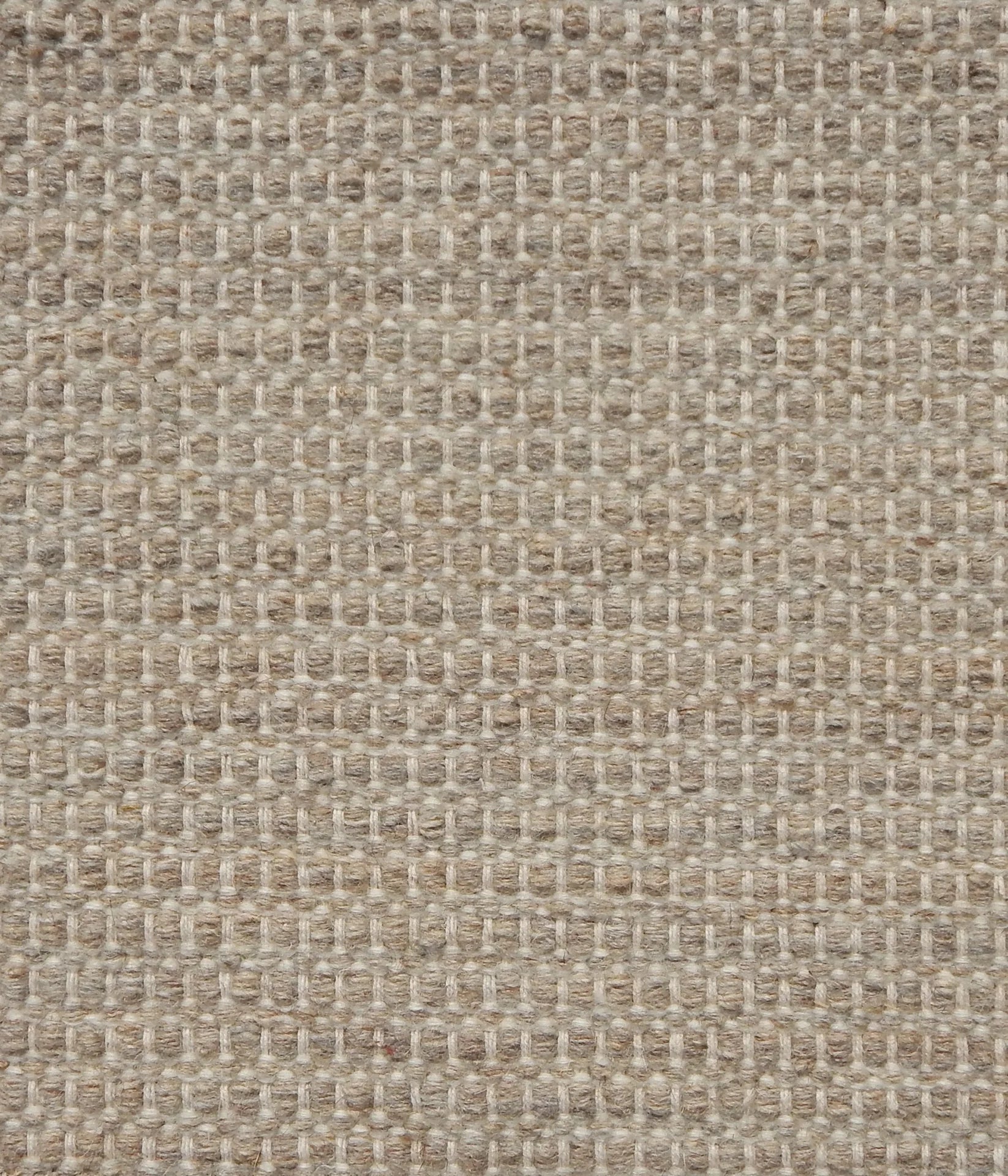 Textured handwoven carpet in oatmeal