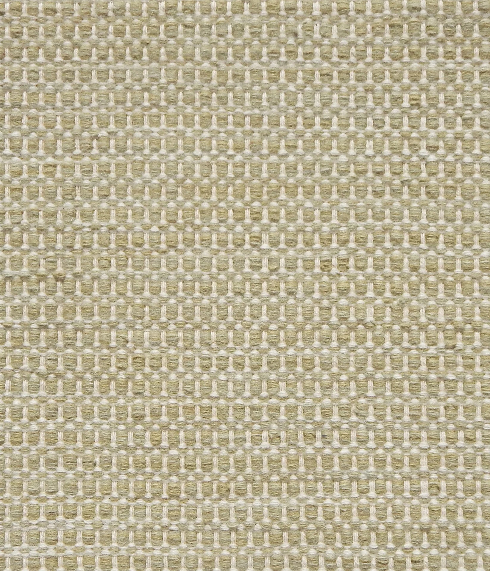 Textured handwoven carpet in pale green.