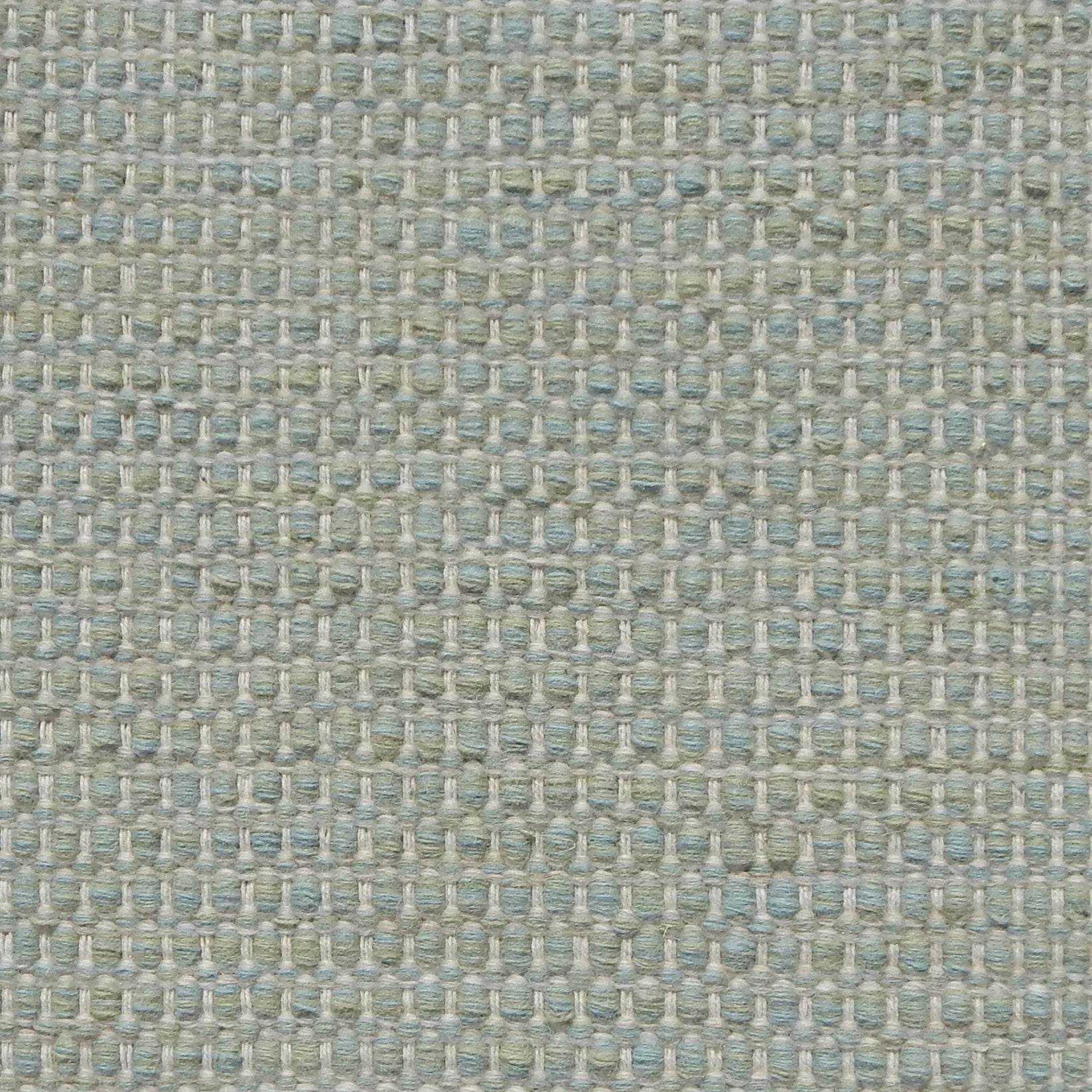 Textured handwoven carpet in pale aqua