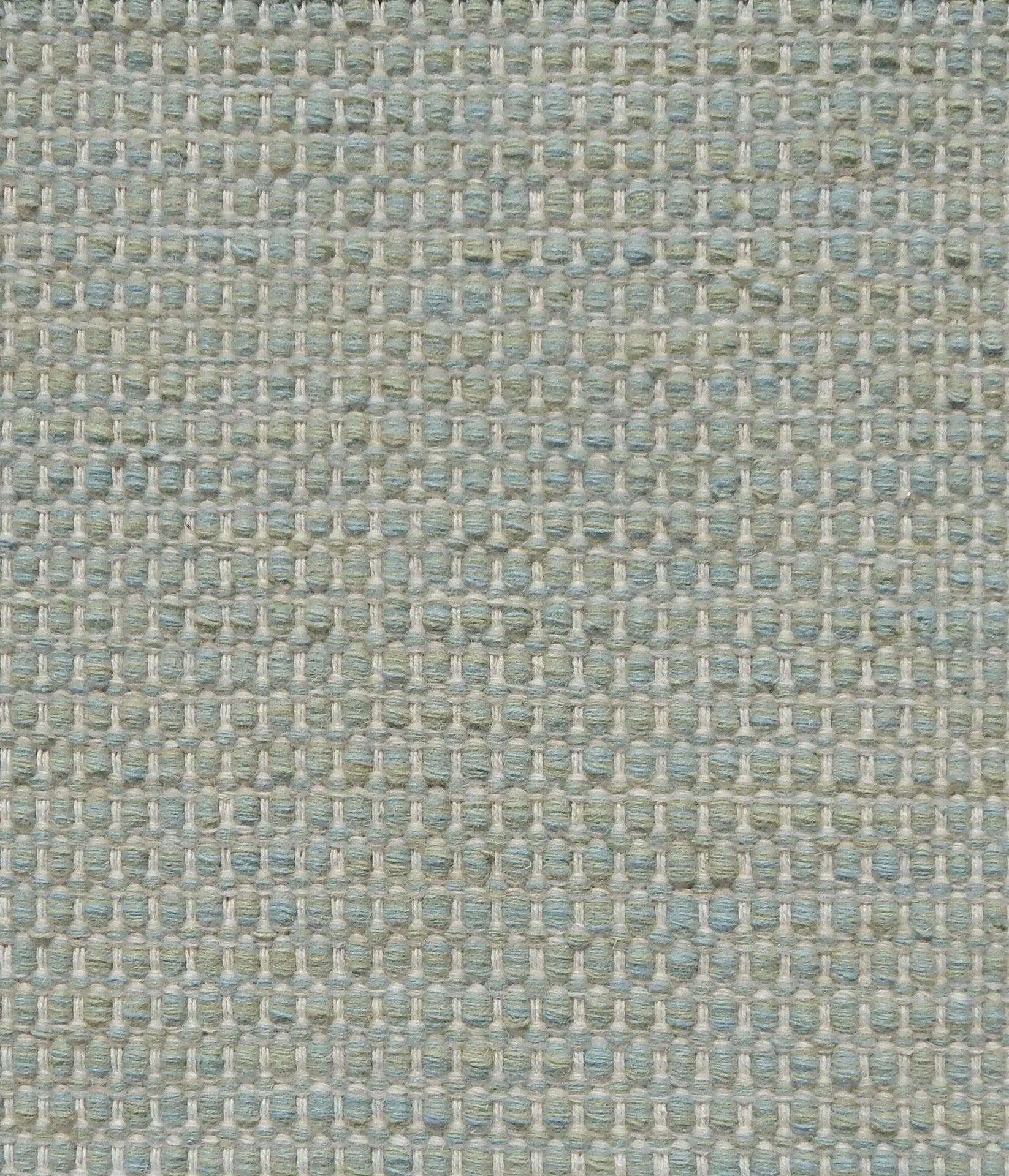 Textured handwoven carpet in pale aqua