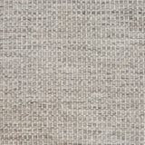 Textured handwoven carpet in light grey.