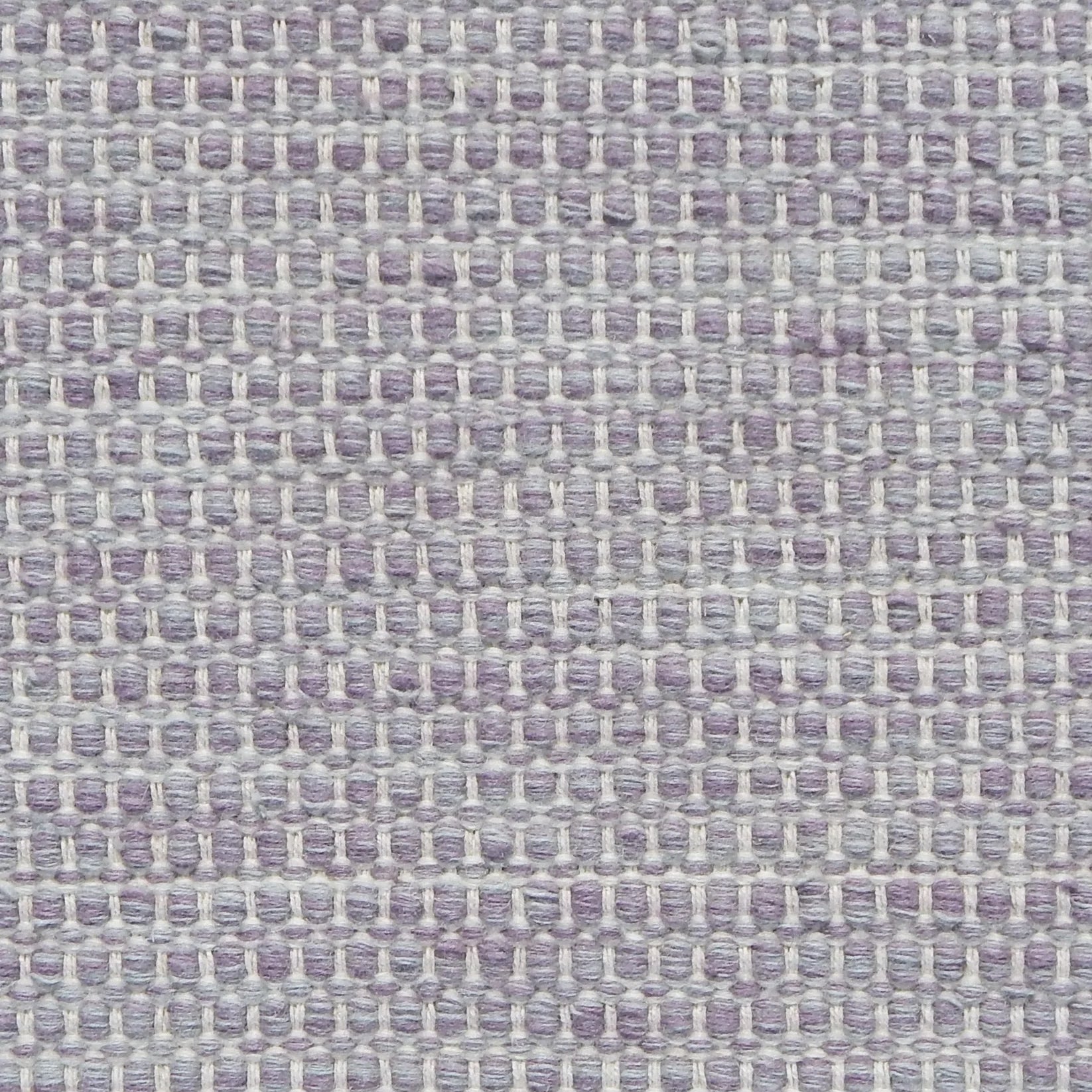 Textured handwoven carpet in pale purple 