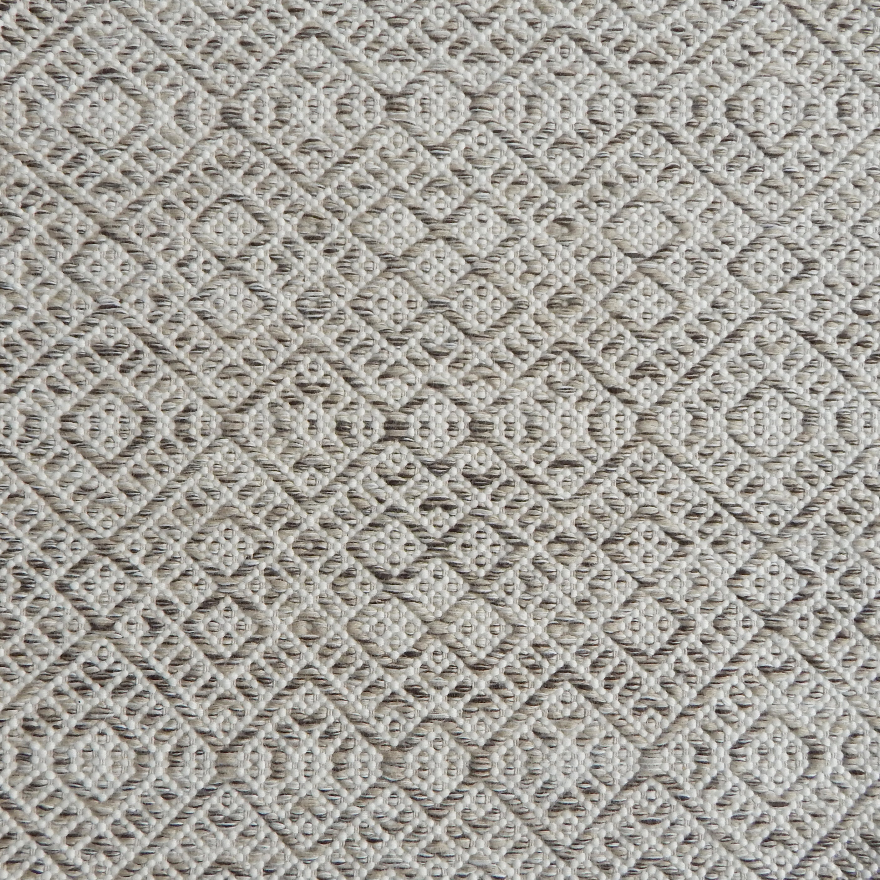 Flatweave rug with an intricate diamond pattern in white and heathered taupe