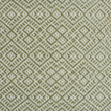 Flatweave rug with an intricate diamond pattern in white and green