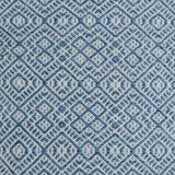 Flatweave rug with an intricate diamond pattern in white and blue