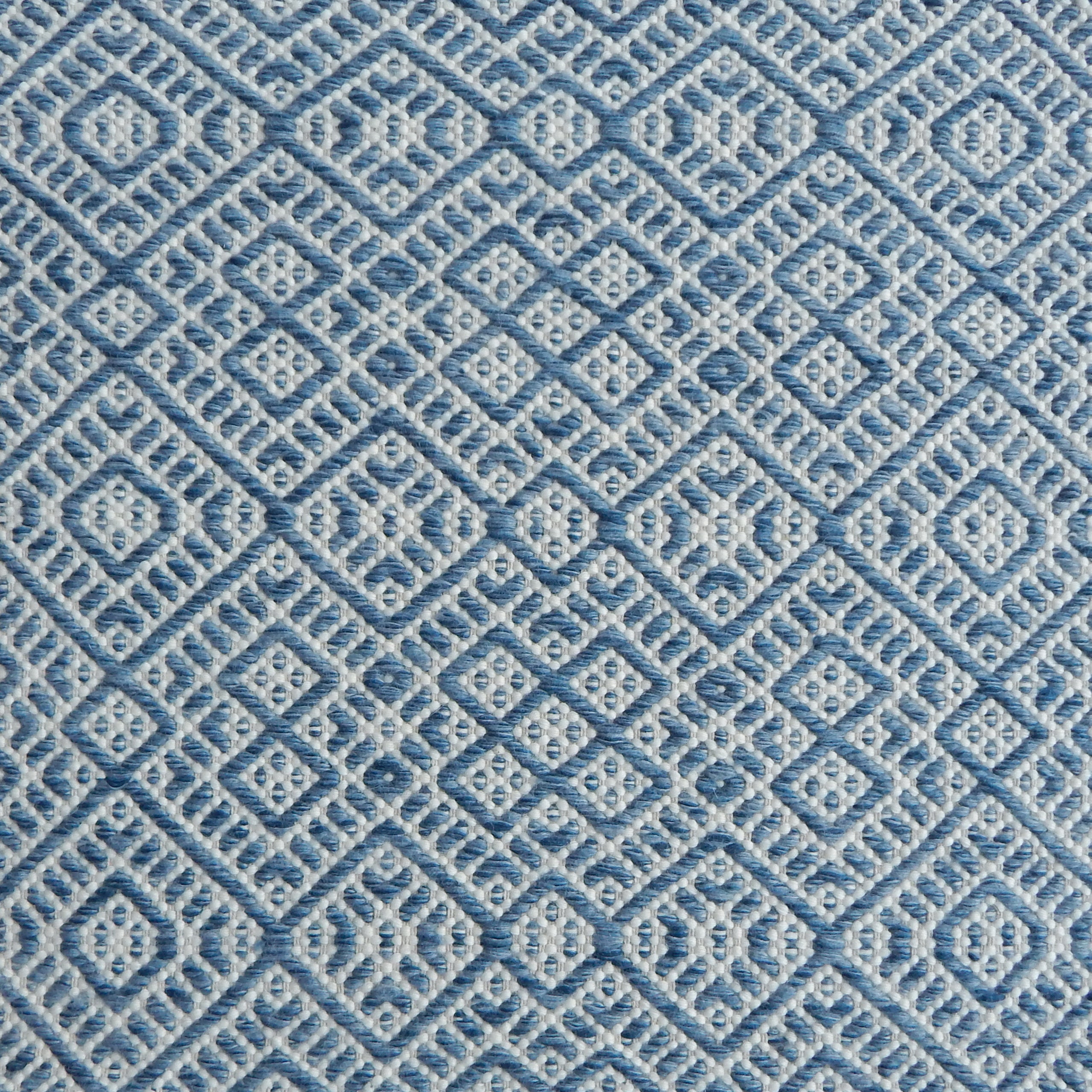 Flatweave rug with an intricate diamond pattern in white and blue