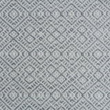 Flatweave rug with an intricate diamond pattern in white and grey