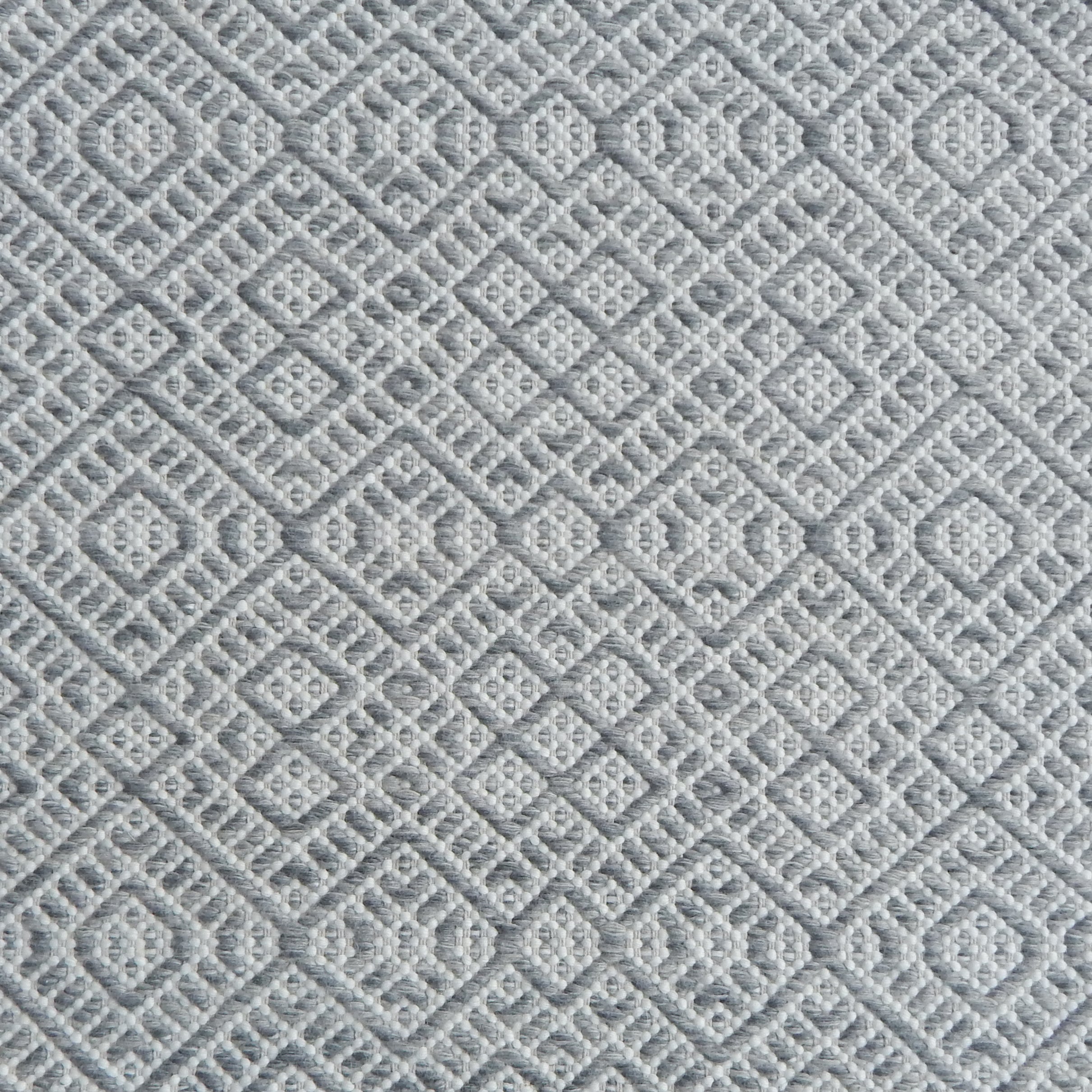 Flatweave rug with an intricate diamond pattern in white and grey