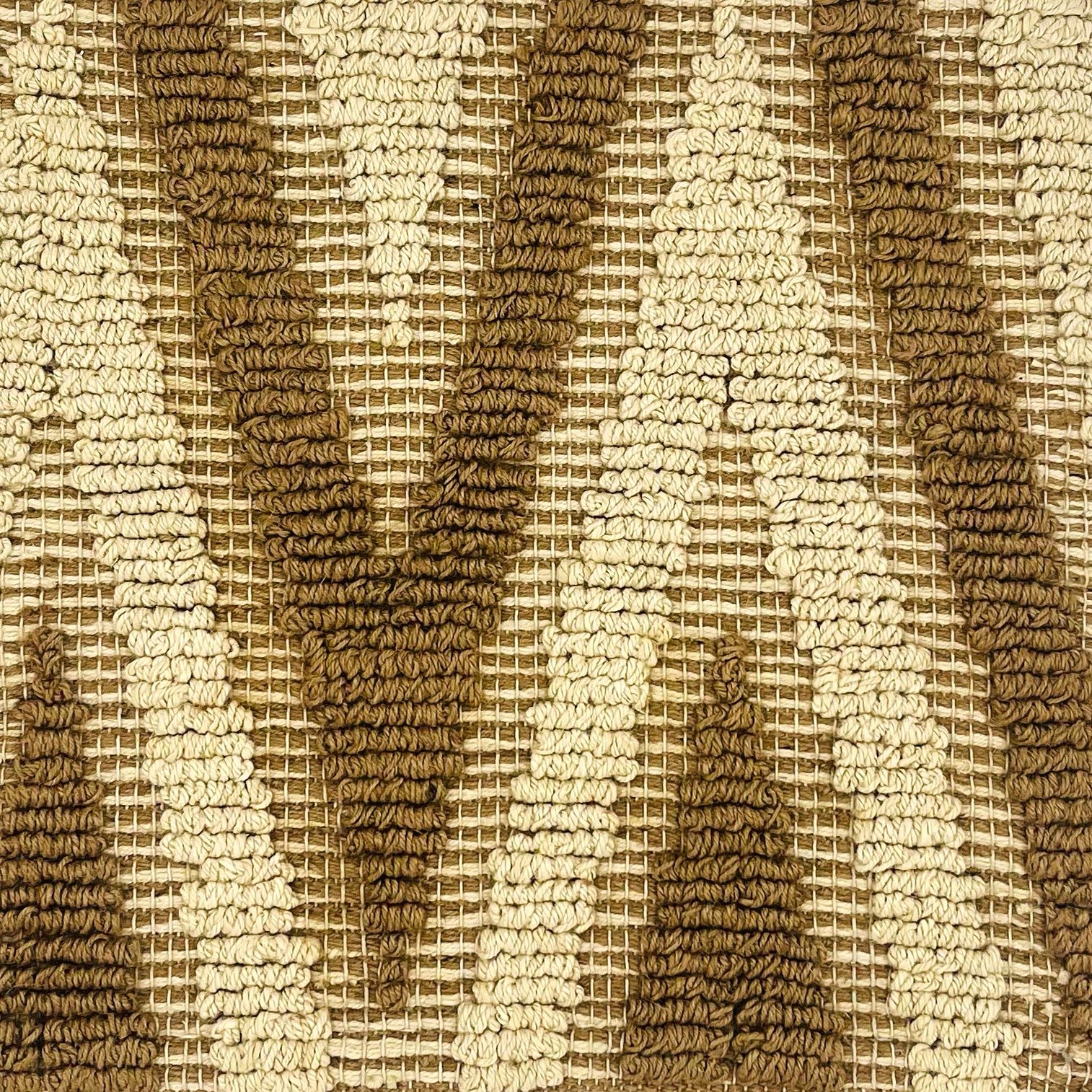 Woven rug swatch in natural fibers in a bold chevron stripe in ivory and bown.