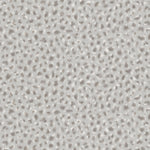 Detail of wallpaper in a painterly animal print in white and gray on a light gray field.