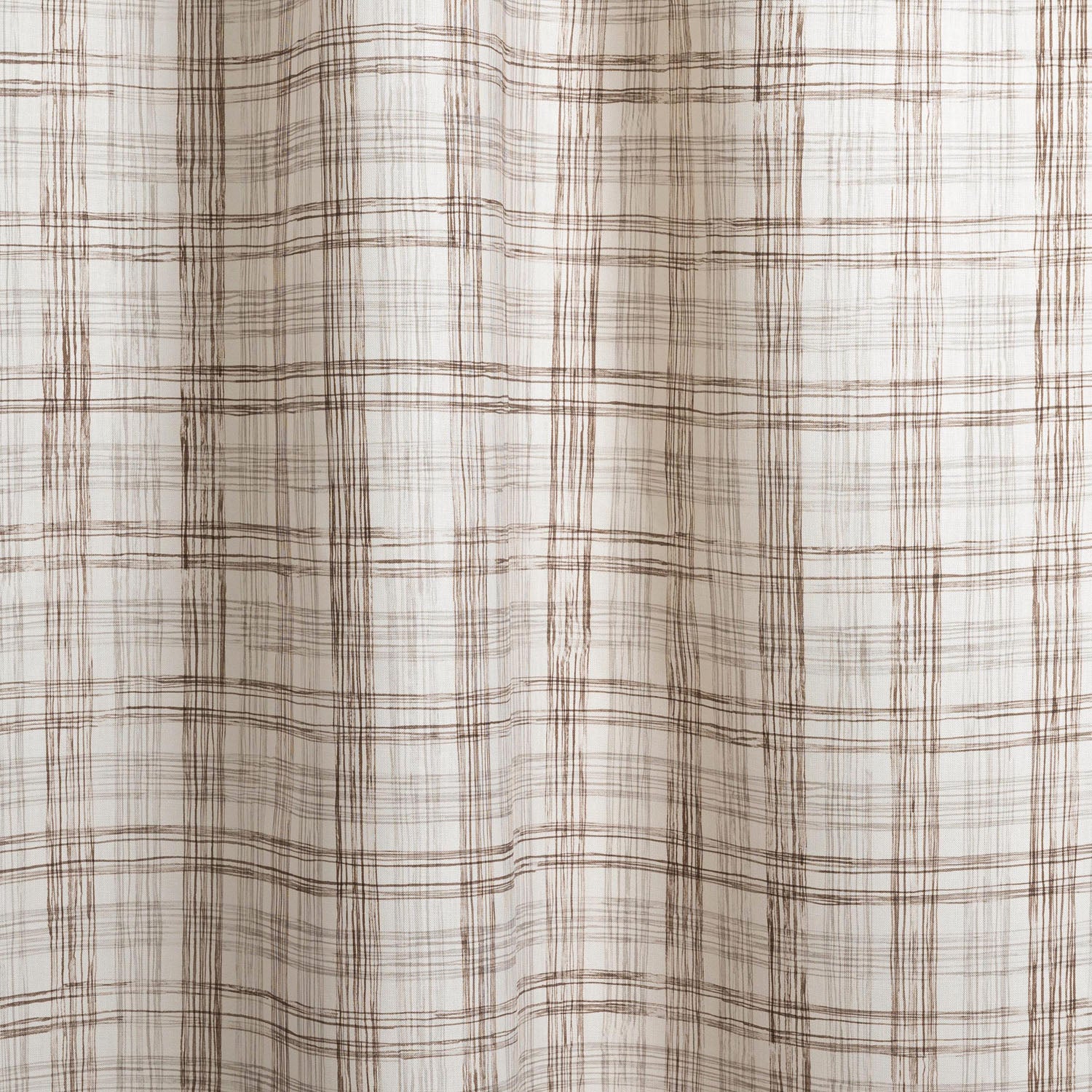 Draped fabric with watercolor plaid pattern in shades of dark brown.
