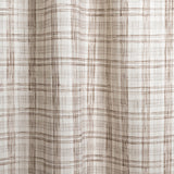 Draped fabric with watercolor plaid pattern in shades of dark brown.