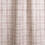 Draped fabric with watercolor plaid pattern in shades of wine red.