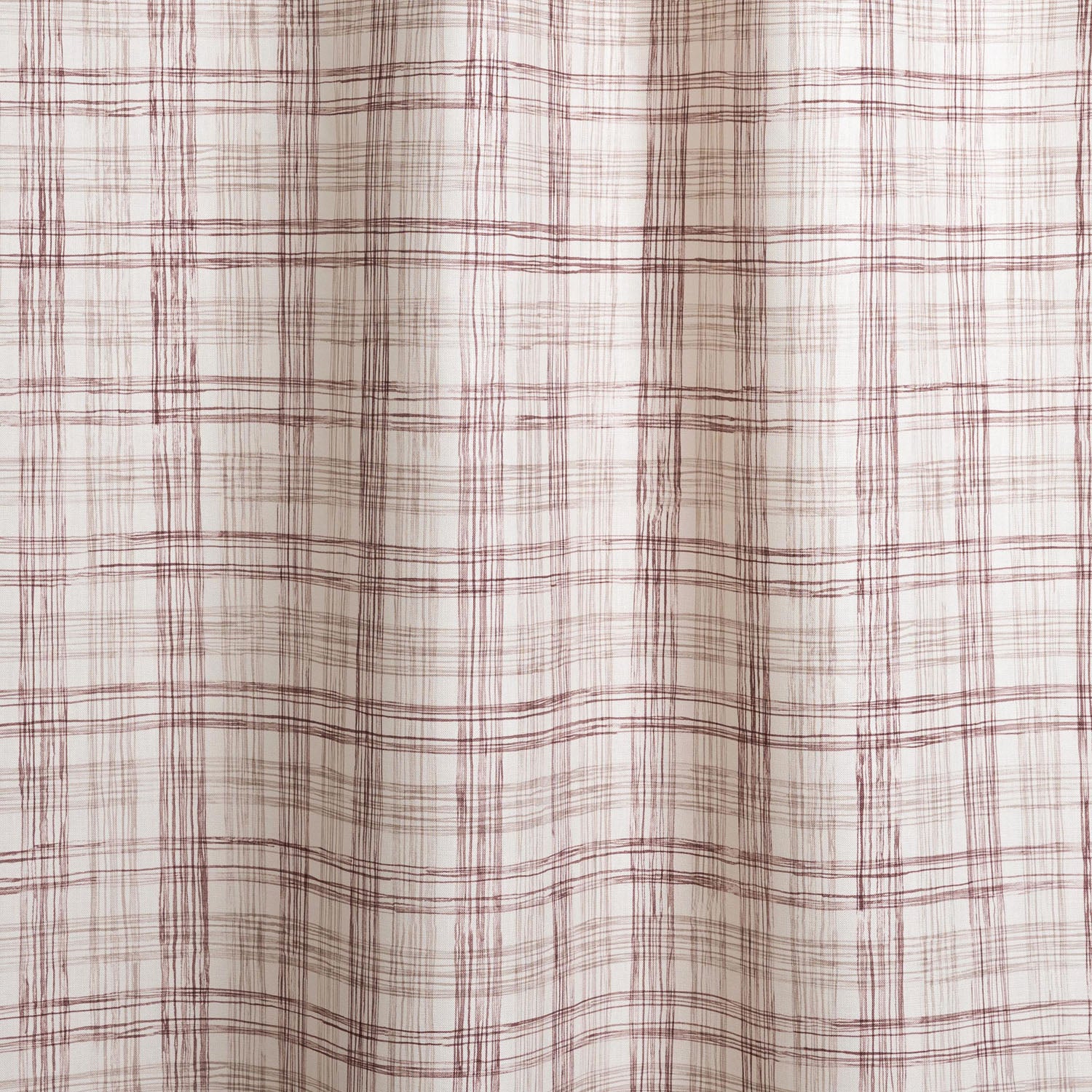 Draped fabric with watercolor plaid pattern in shades of wine red.