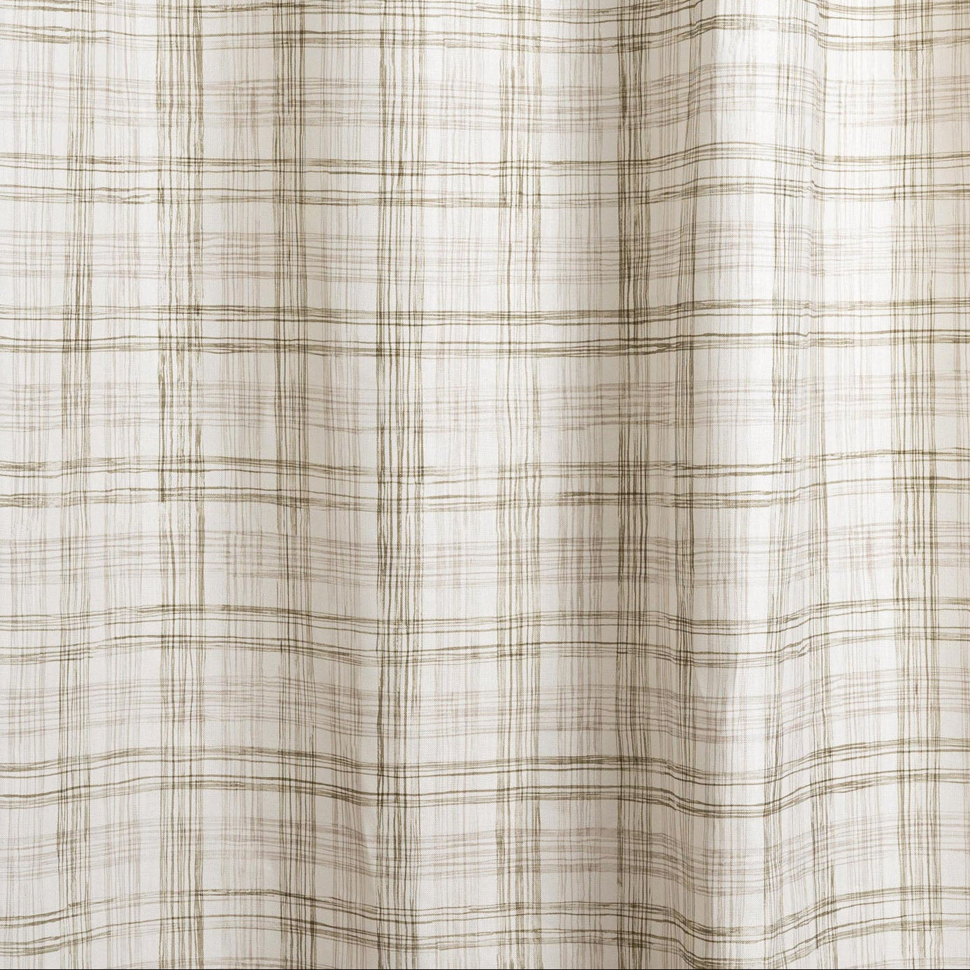 Draped fabric with watercolor plaid pattern in shades of olive green.