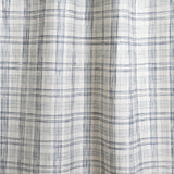 Draped fabric with watercolor plaid pattern in shades of blue. 