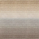 Broadloom carpet in a herringbone pattern in a subtle ombré color from warm brown to tan.